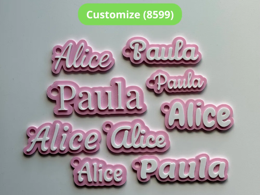 Custom 3D printed name keychains in pink and white PLA